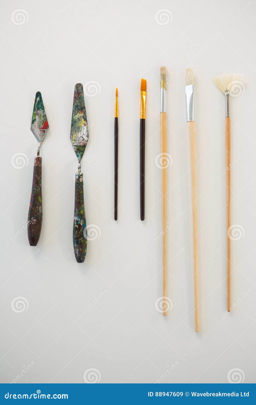 Palette Knives and Paint Brushes Arranged in a Row Stock Image Image