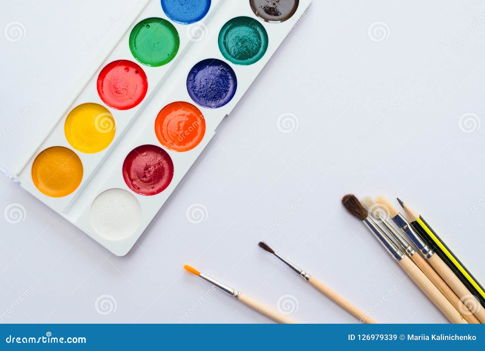 Palette of Watercolors and Paintbrushes on White Paper Background ...