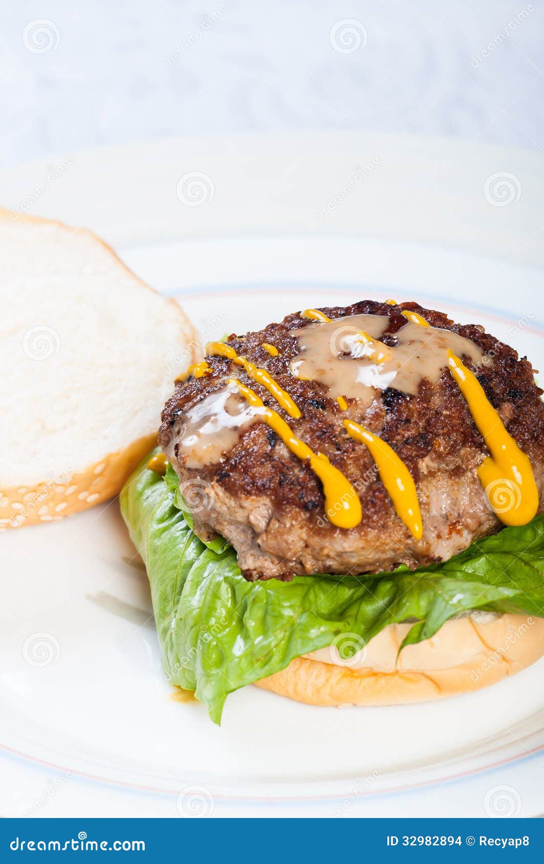 Pan Fried Burger with Mustard and Sesame Dressings Stock Photo Image