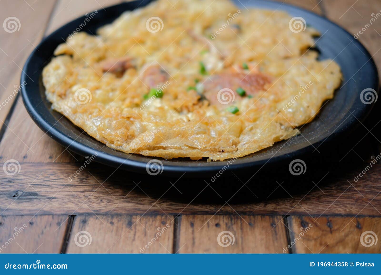 Panfried Crispy Mussel Pancake. Oyster Fried in Egg Batter Stock Photo