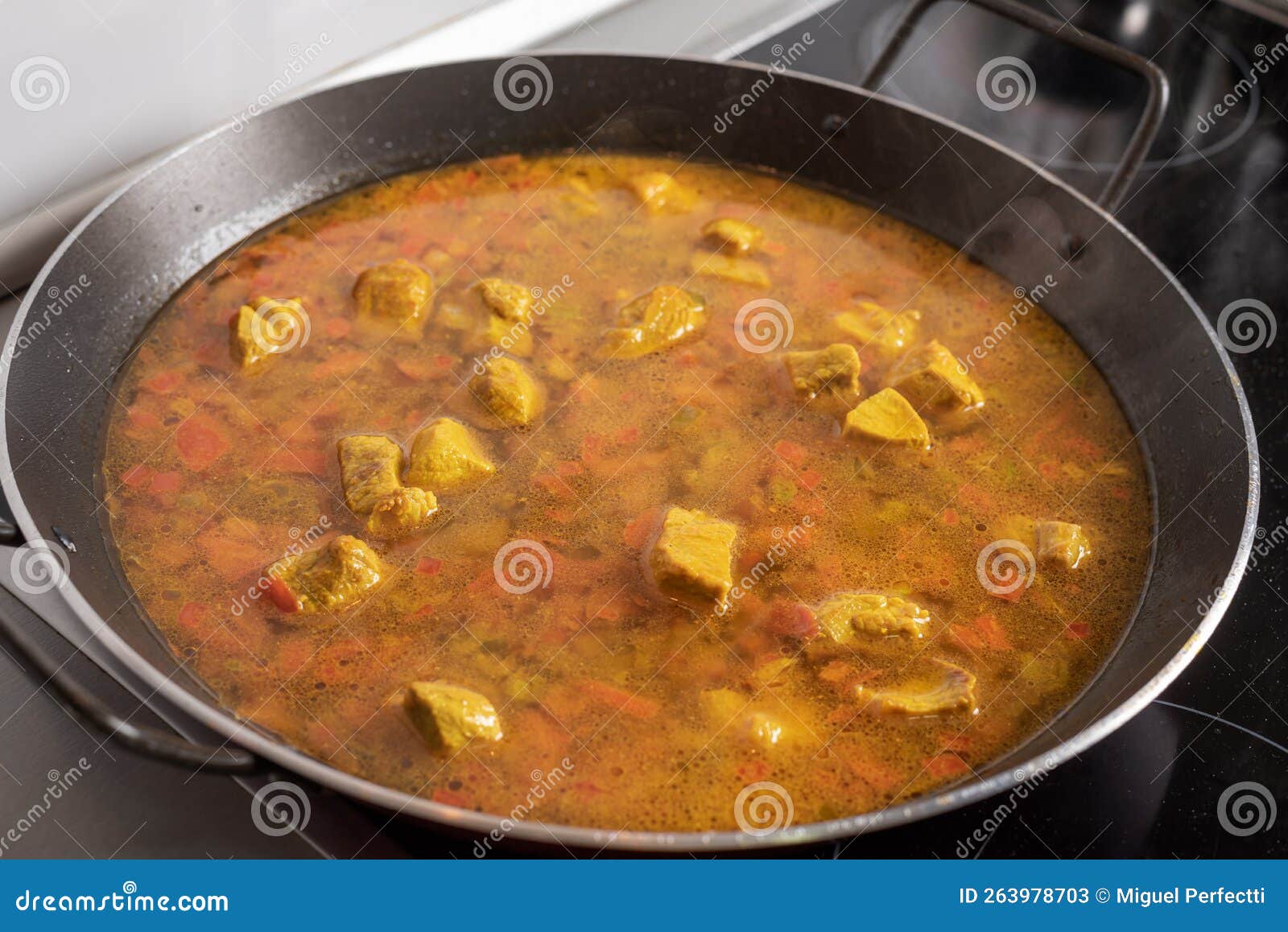 Pan for Paellas with Vegetables, Ingredients and Meat Taking