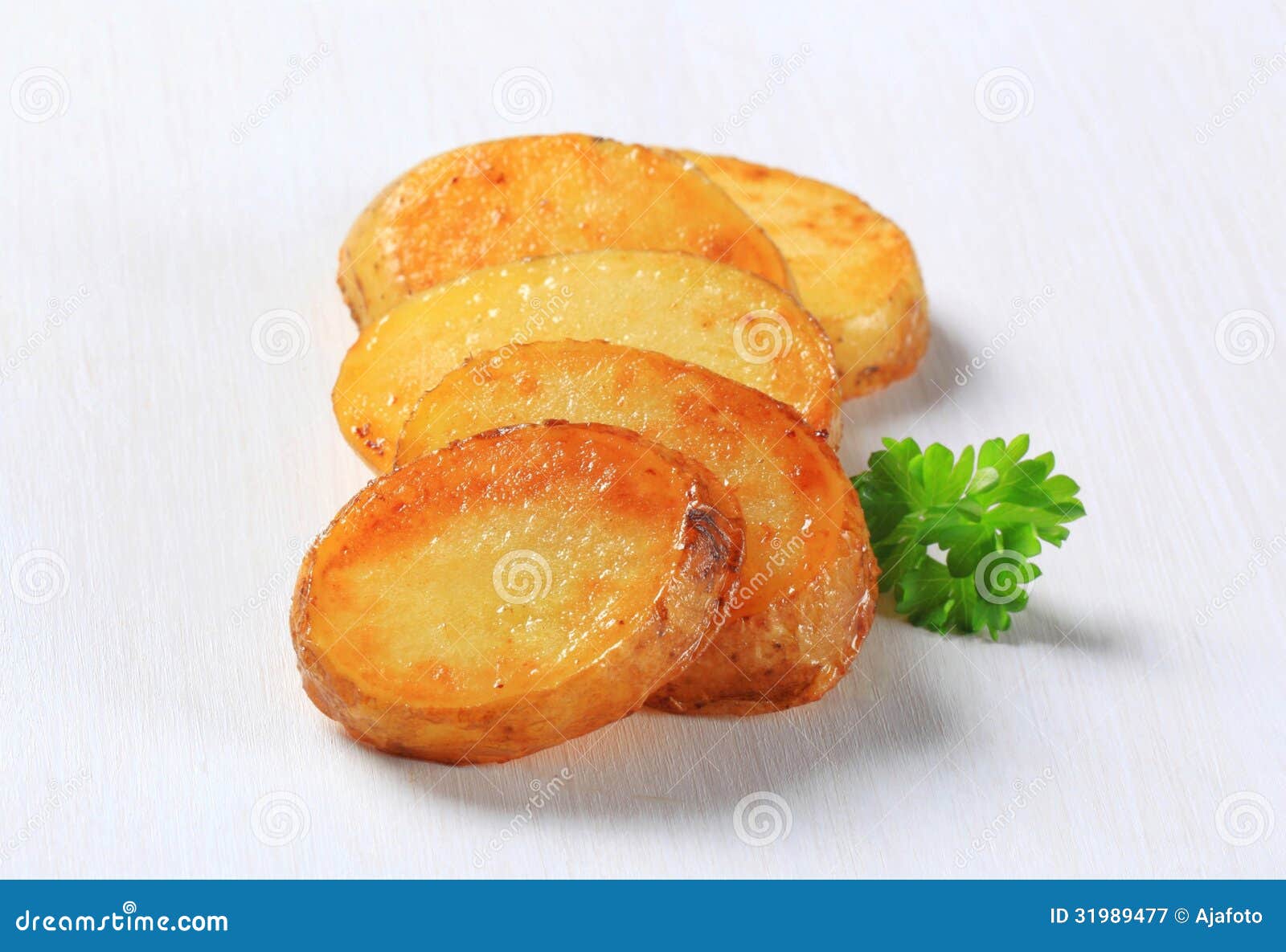 Pan roasted potato slices stock image. Image of studio 31989477
