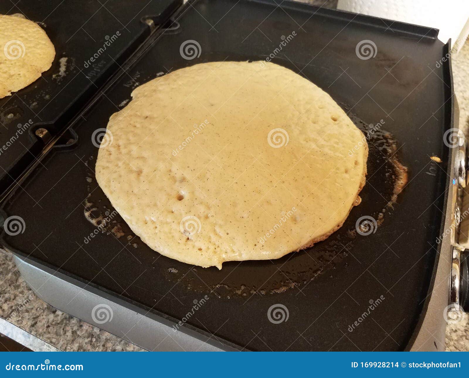 Pancake Cooking on a Griddle or Stove Stock Photo Image of circle