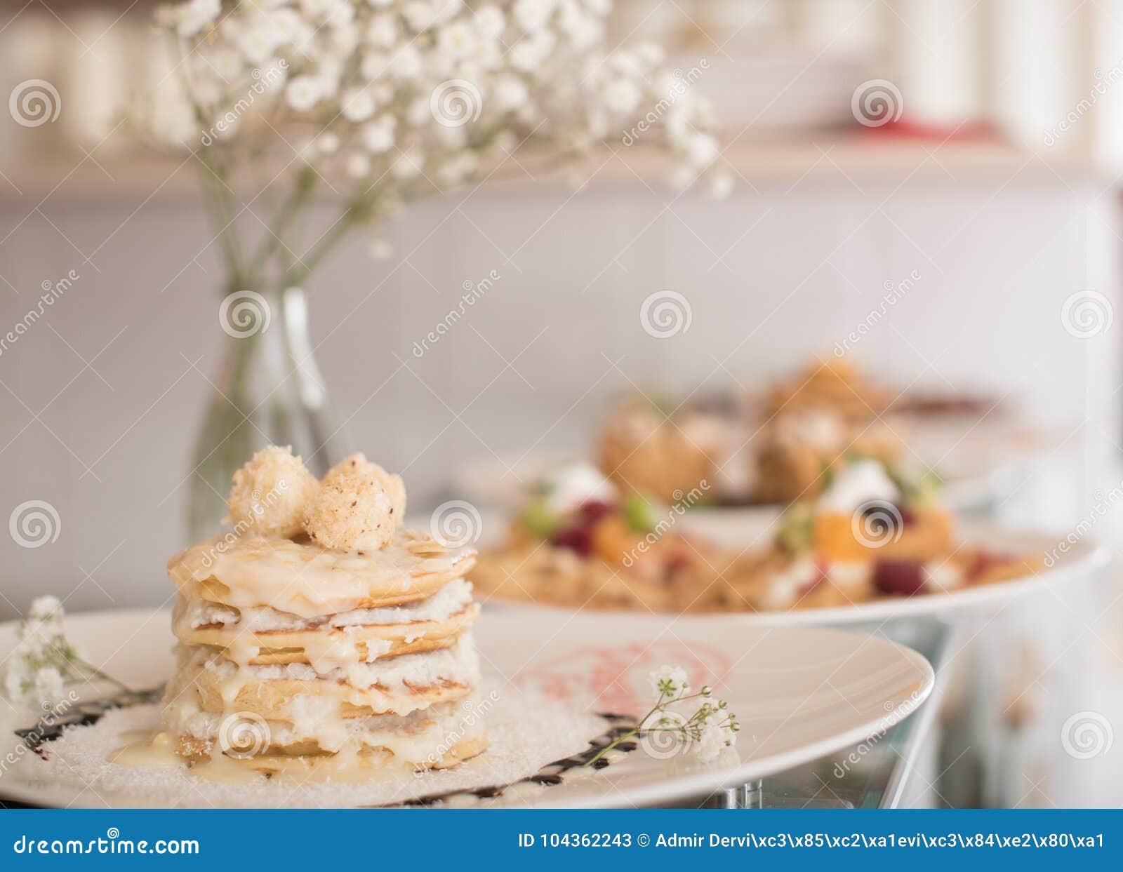 pancakes with decorations and flowers in vase
