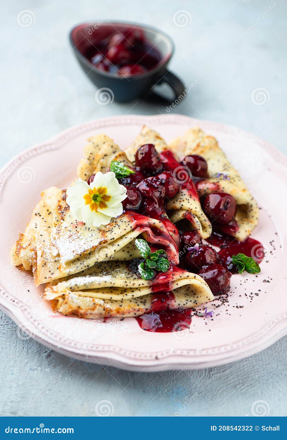 Pancakes with cherries stock photo. Image of cherries 208542322