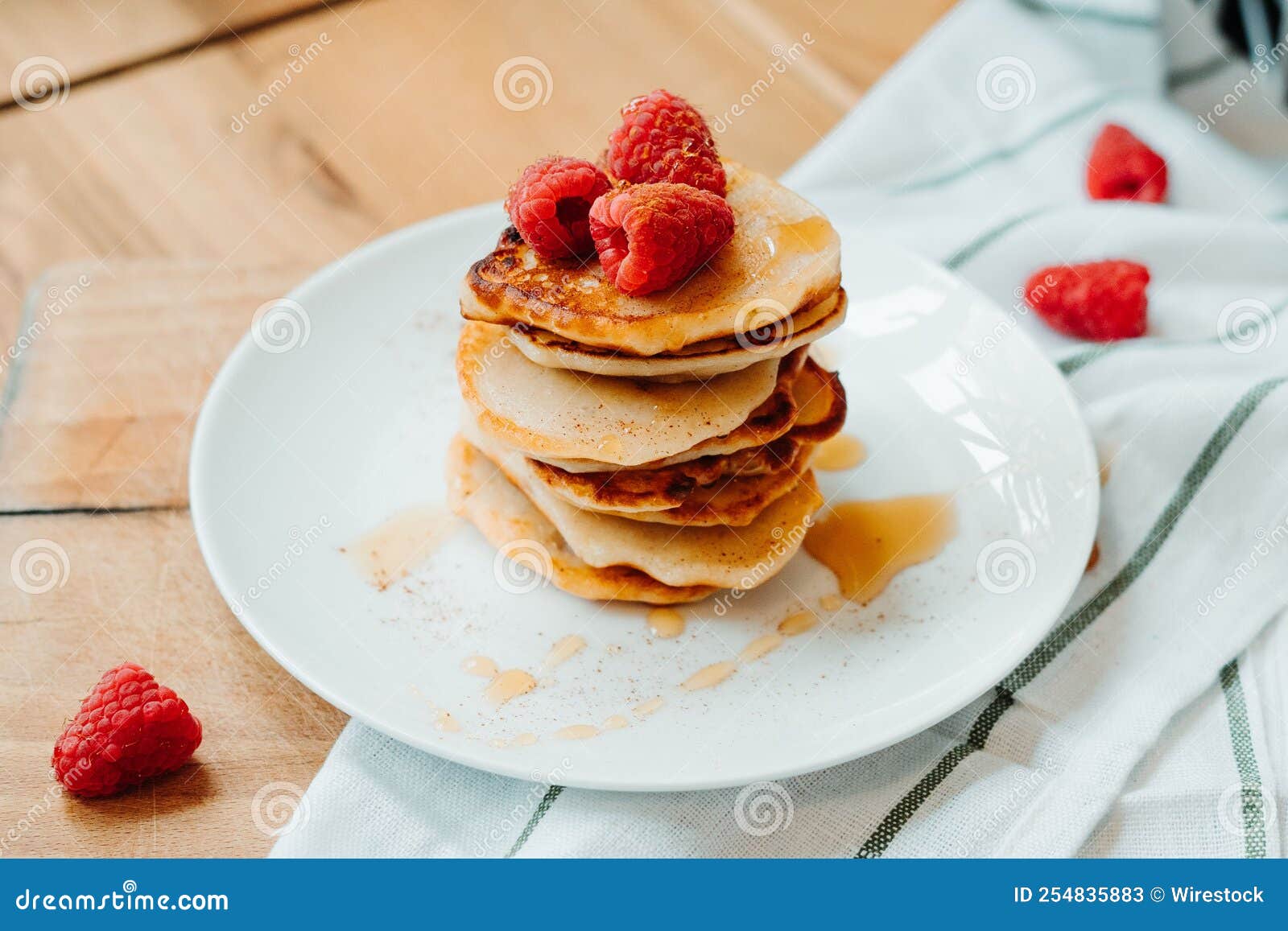 Pancakes with Raspberries Lying on the Table, Stacking Stock Image