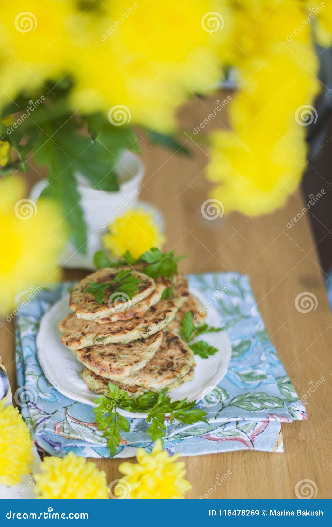 Pancakes from Vegetables on the Table. Yellow Flowers. Healthy Food ...