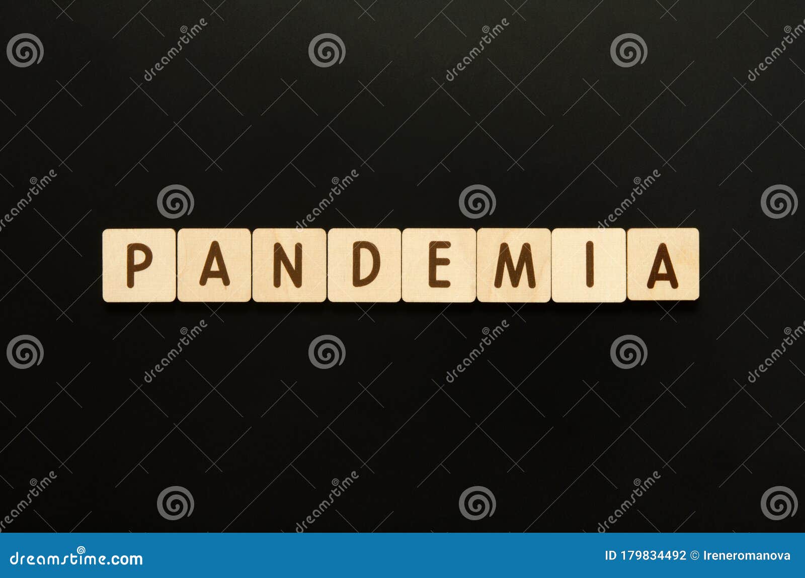 pandemia - word from wooden blocks with letters. top view on black background.