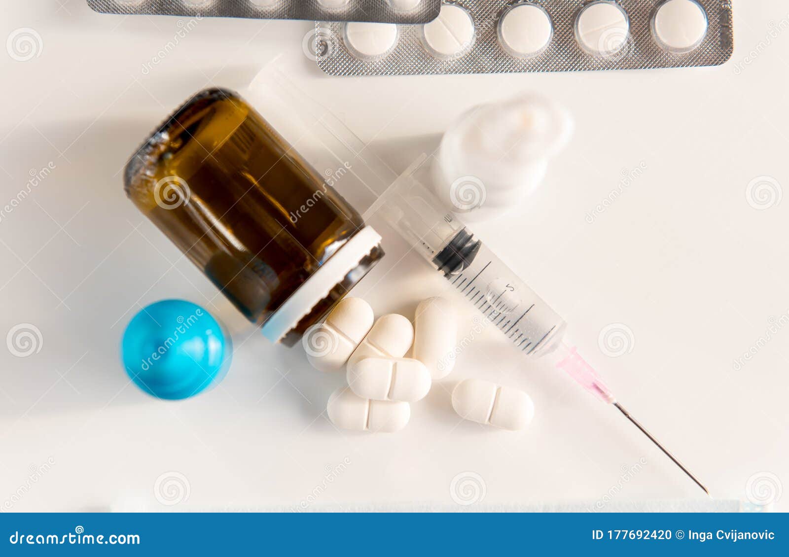 pandemic of coronavirus covid-19. spray, pills, drops and syringe on white background. medicina, quarantine.
