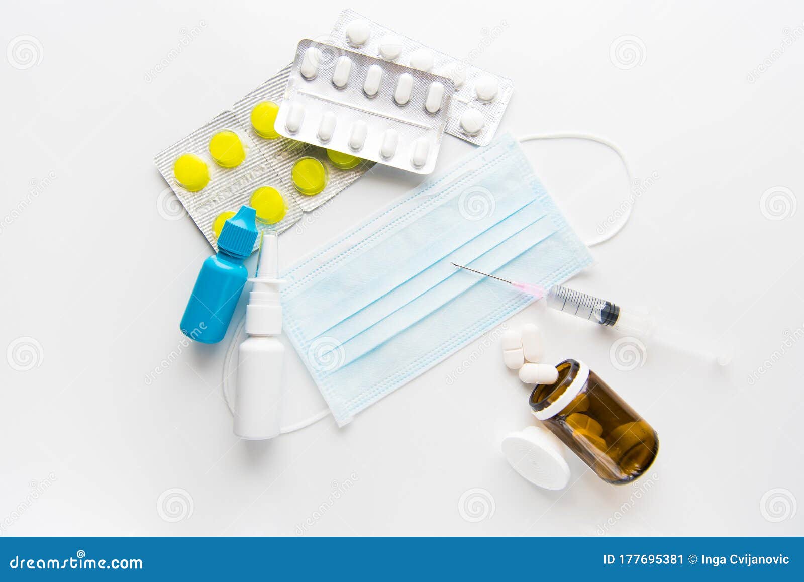 mask,spray, pills, drops and syringe on white background