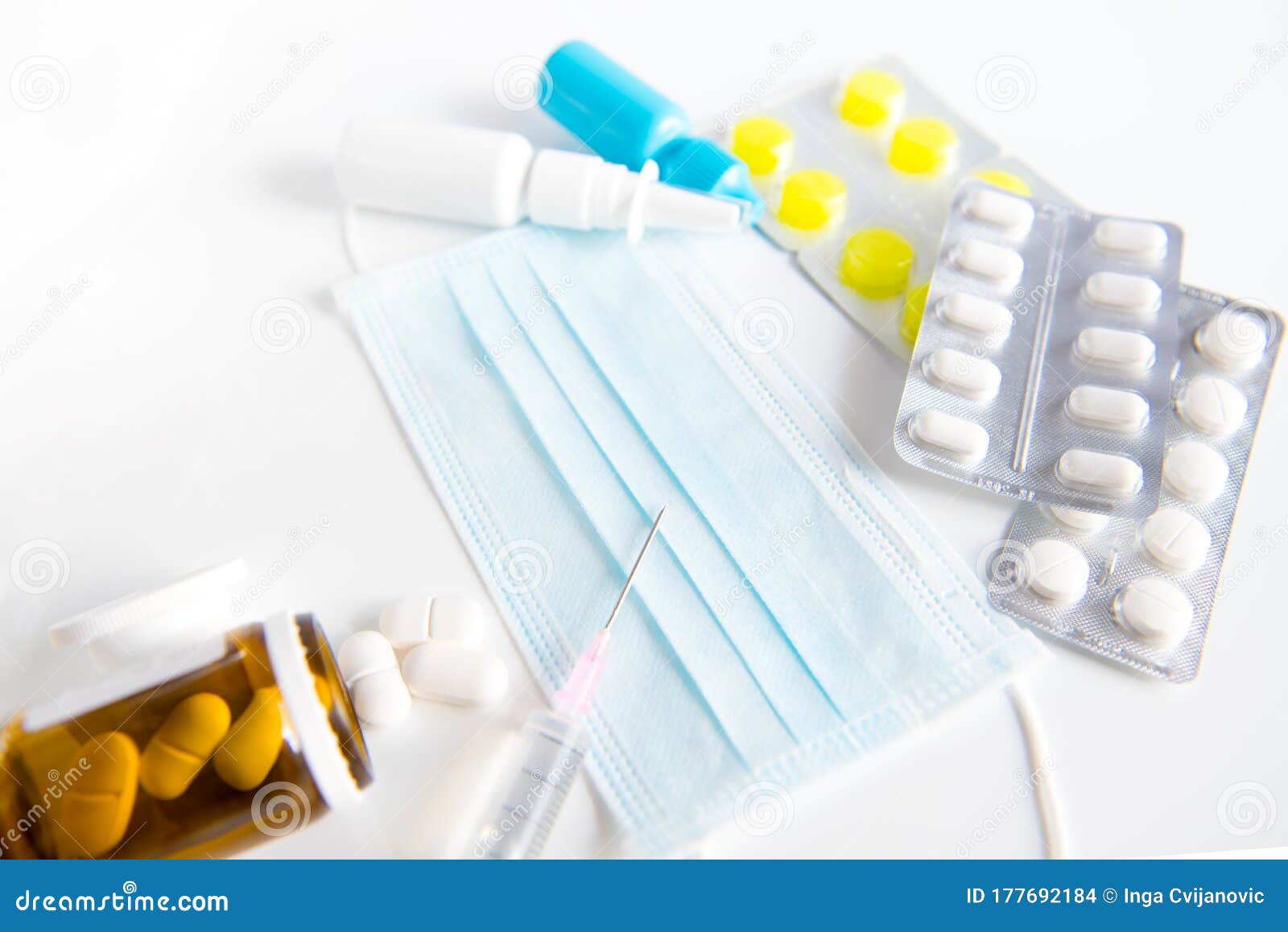 spray, pills, drops and syringe on white background.