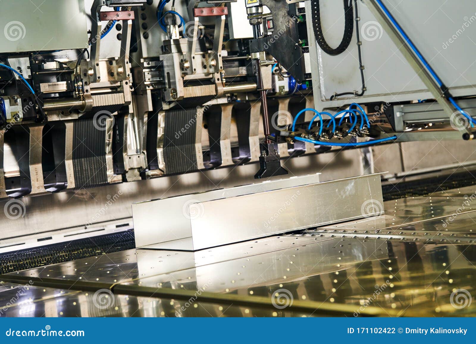 Panel Bending Machine at Work. Process of Metal Sheet Forming Stock