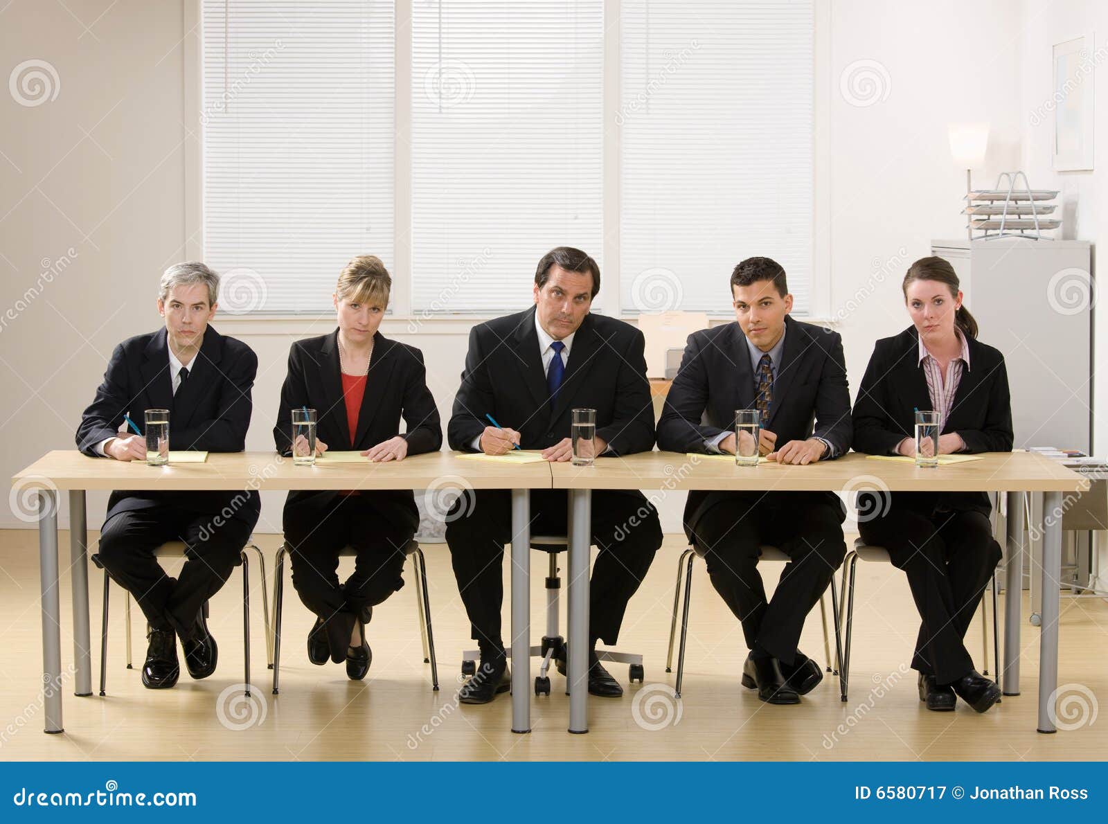 panel of co-workers about to conduct an interview