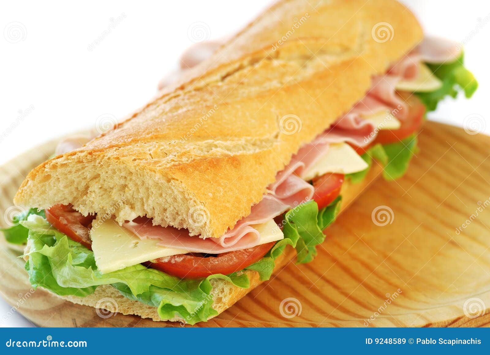Panino Del Baguette Con Il Prosciutto Ed Il Formaggio Immagine Stock