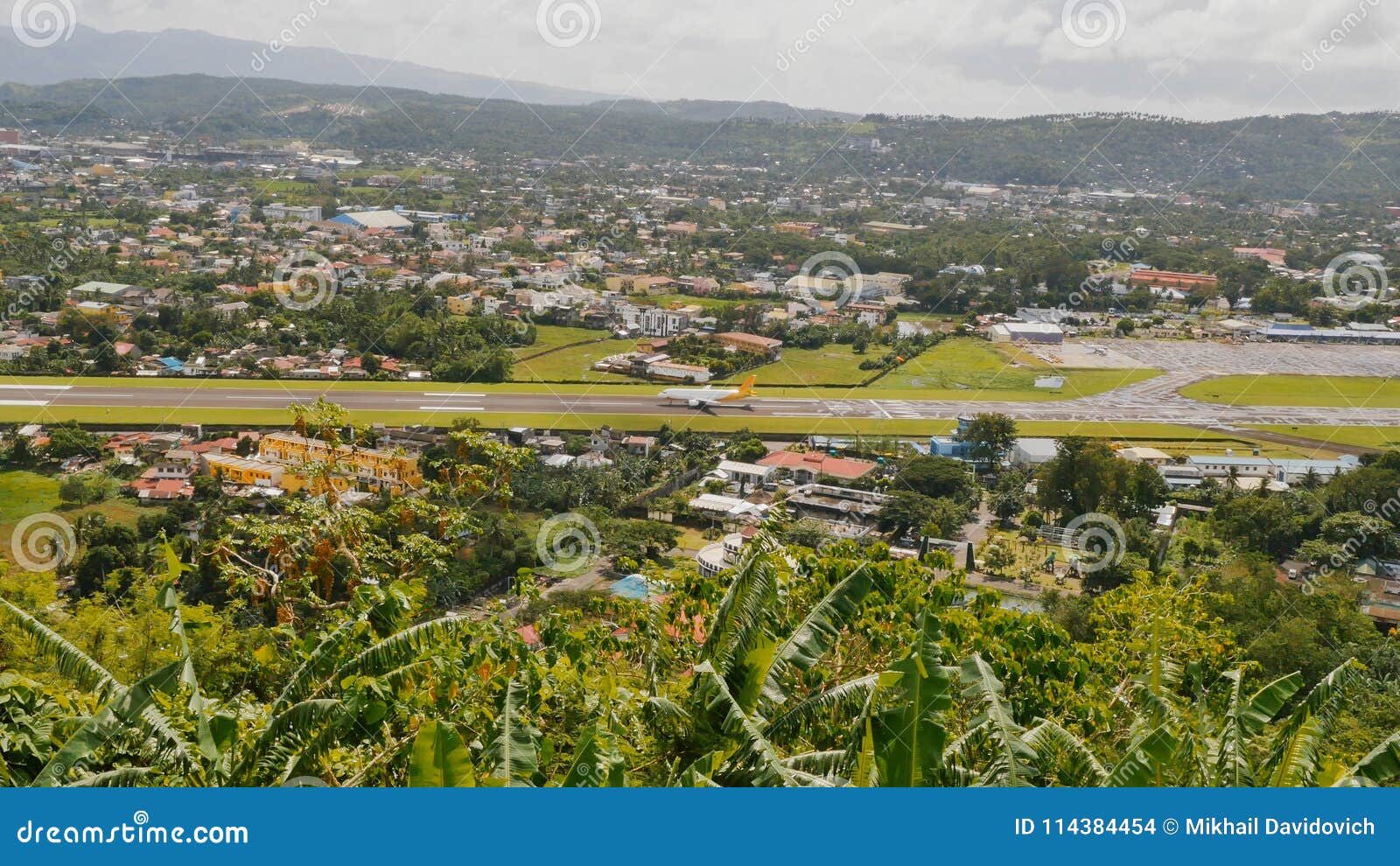 panorama of the city of legazpi on the background of the airport. luzon, philippines.