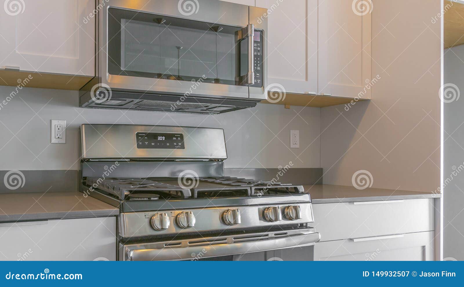 Panorama Cooking Range And Wall Mounted Microwave Inside A Modern