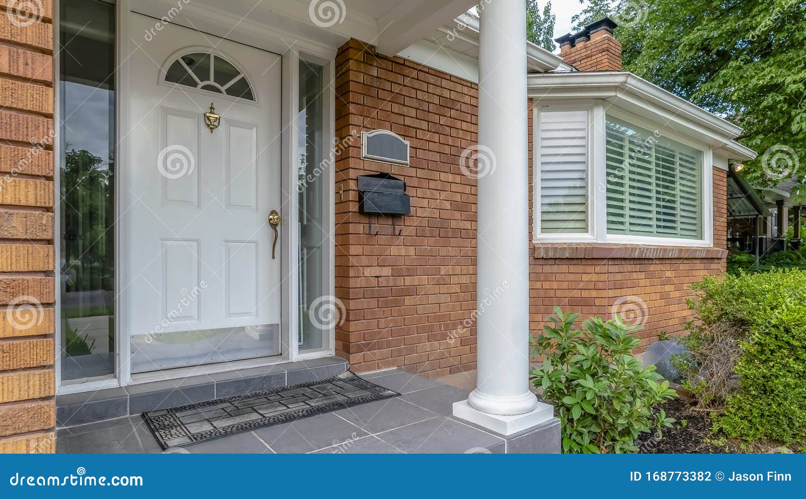 Panorama Facade of Home with Brick Exterior Wall Porch Bay Windows and  White Front Door Stock Photo - Image of architecture, green: 168773382