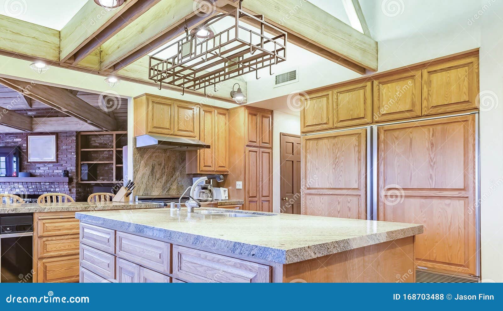 Panorama Frame Bright, Open and Warm Kitchen with Vaulted Ceilings and