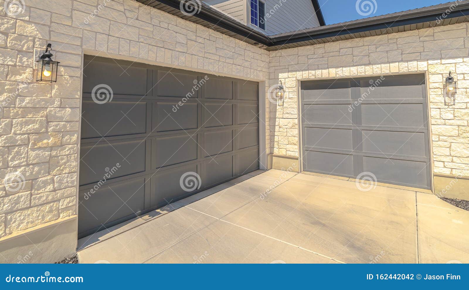 Panorama Frame Double Garage Doors at Right Angles Exterior Stock Photo
