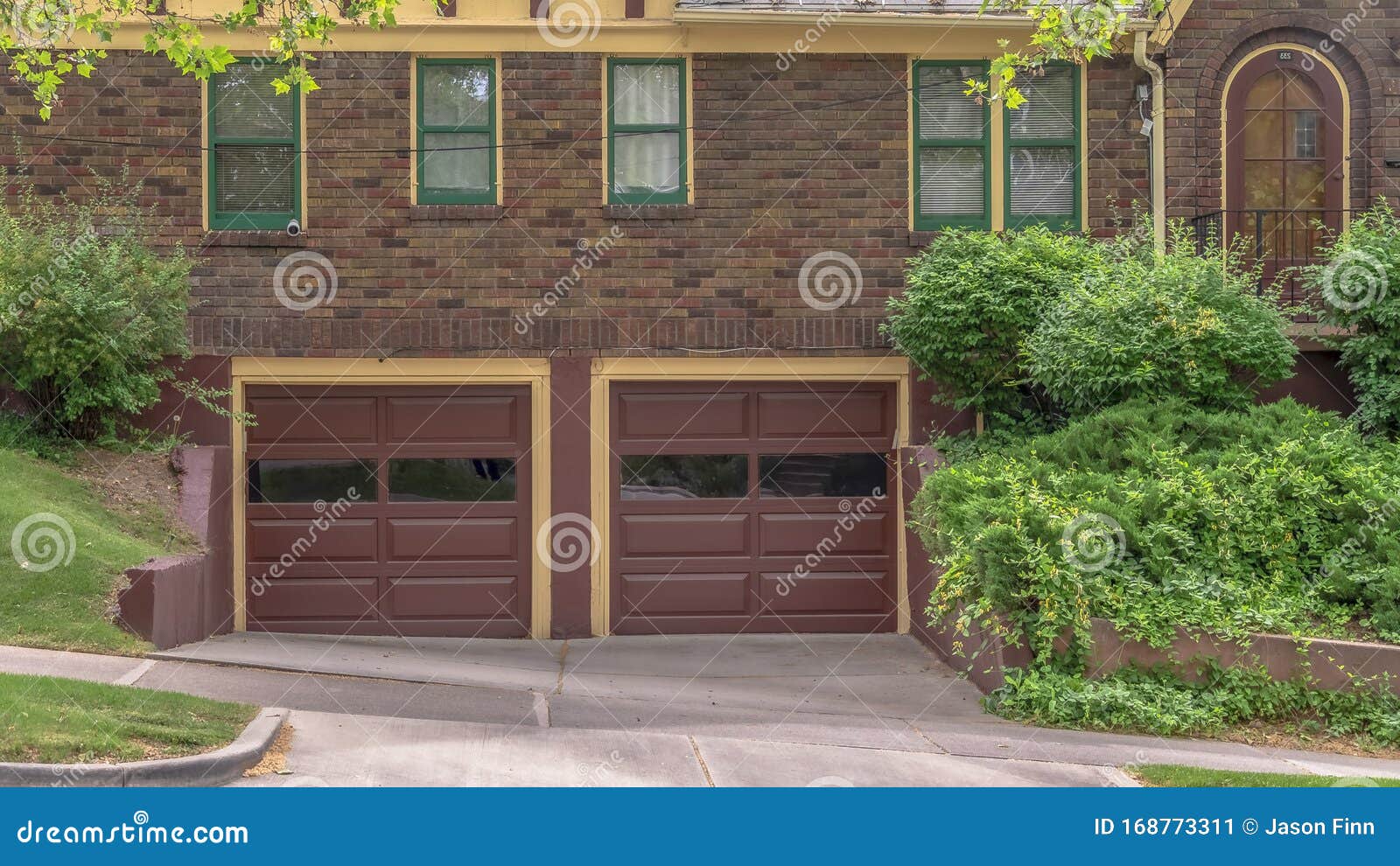 Panorama Frame Two Car Garage With Glass Panes On Door Of A House With