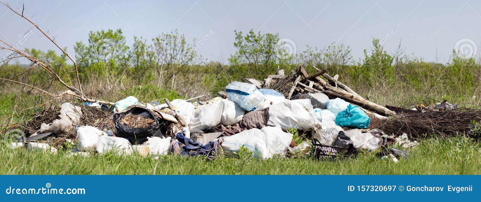 Panorama of a Garbage Dump in a Field. Environmental Pollution. Poverty