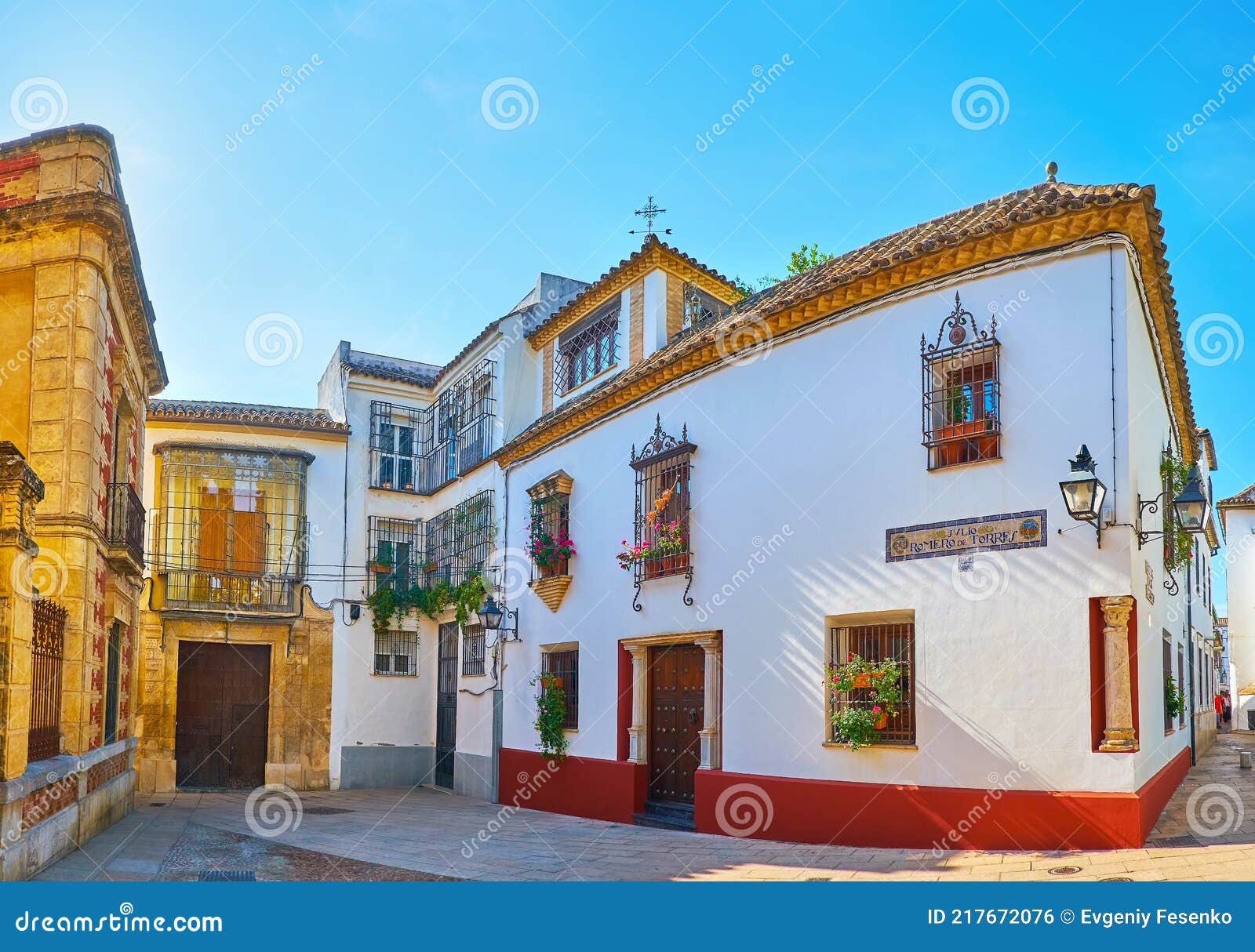 panorama of julio romero de torres stret with historic mansions, cordoba, spain