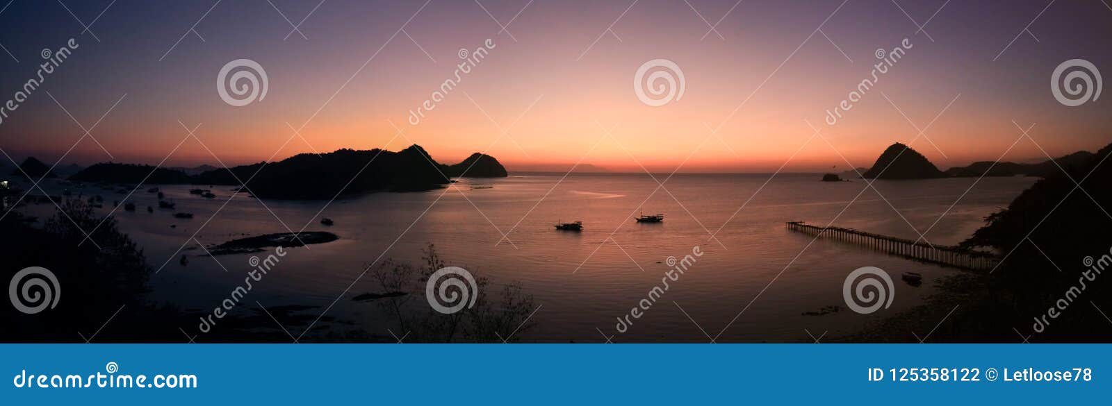 panorama on labuan bajo bay at dusk, nusa tenggara, flores island, indonesia