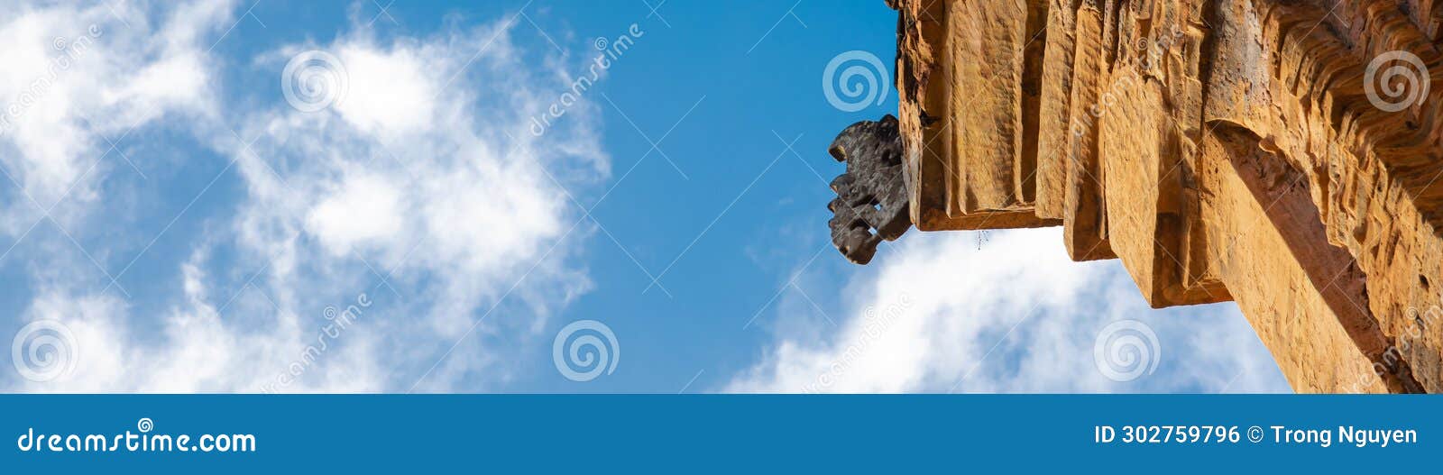 panorama looking up corner of north tower or thap chinh with ancient carved pattern of statues, ponagar cham towers built of
