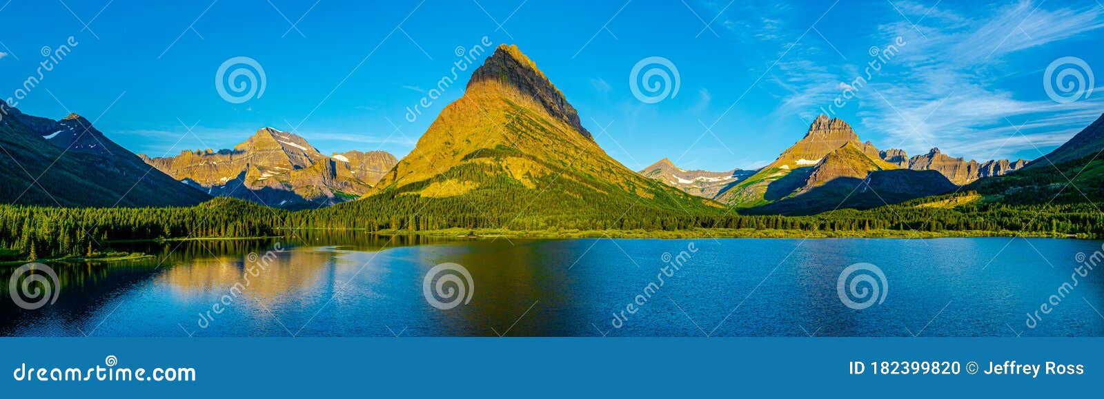 0000292_panorama of a morning sunrise over swiftcurrent lake with  mount gould, grinnell point and  mount wilbur in the