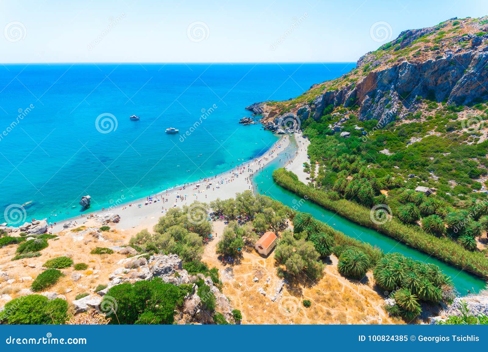 panorama of preveli beach at libyan sea, river and palm forest, southern crete.