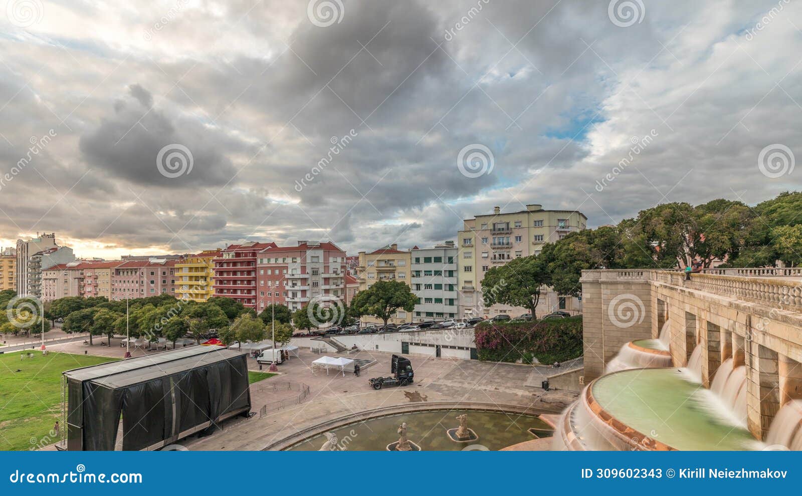 panorama showing aerial view of jardim da alameda in lisbon with the luminous fountain timelapse during sunset.