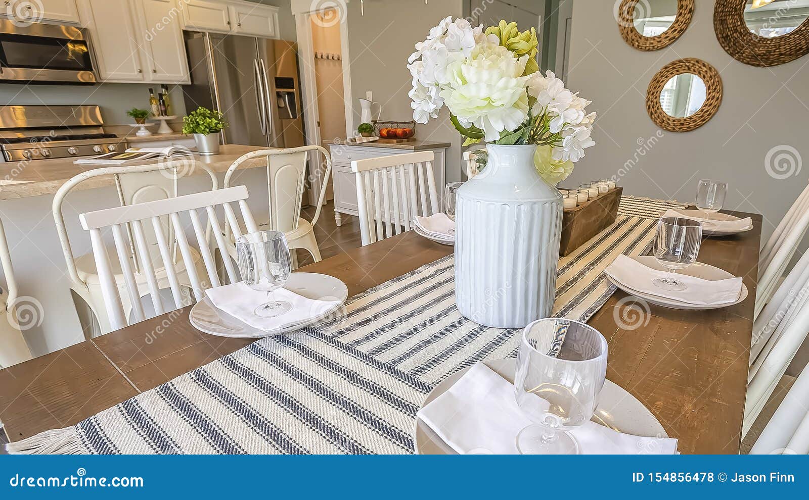 Panorama Table Setting Inside a Dining Room with Brown Table and White