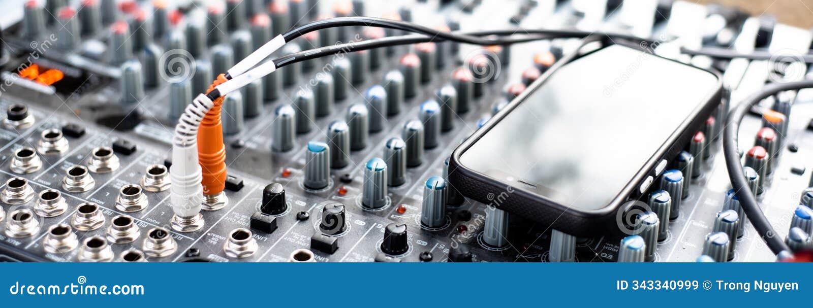 panorama view professional audio bus mixer to smartphone via usb cable interface broadcast live music performance at outdoor party