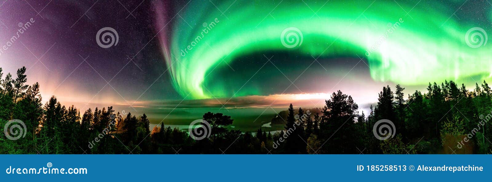 panorama view of strong northern lights and atmospheric phenomenon `steve` meets milky way. steve appears as a purple and green