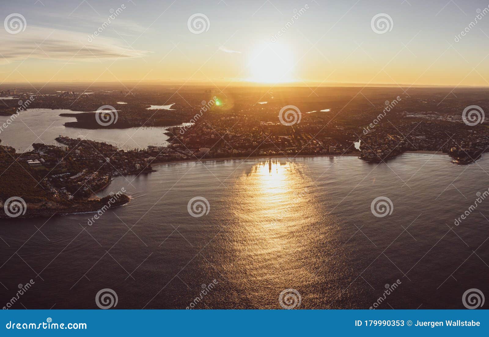 panoramic aerial drone sunset view of manly beach, an affluent seaside suburb of sydney, new south wales, australia.