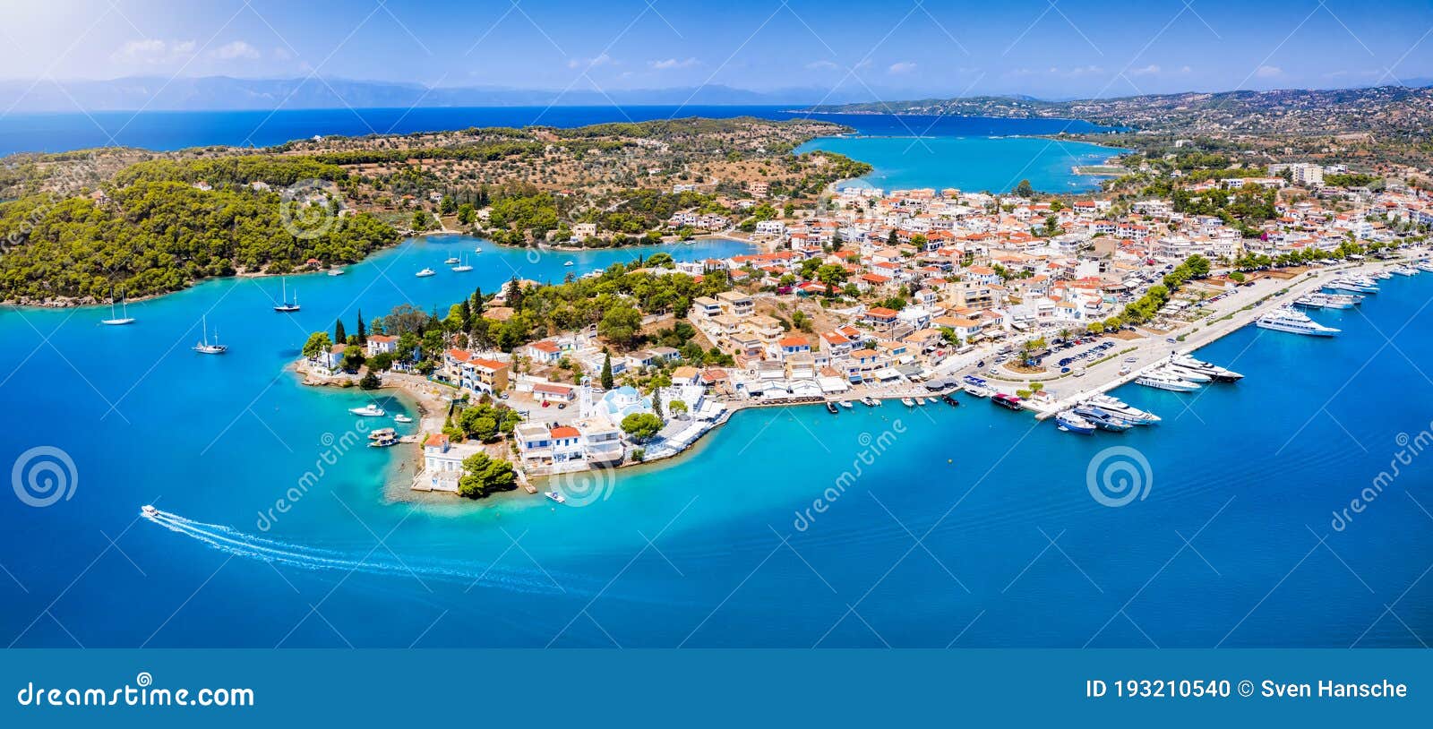 panoramic, aerial view to the port and city of porto cheli, greece