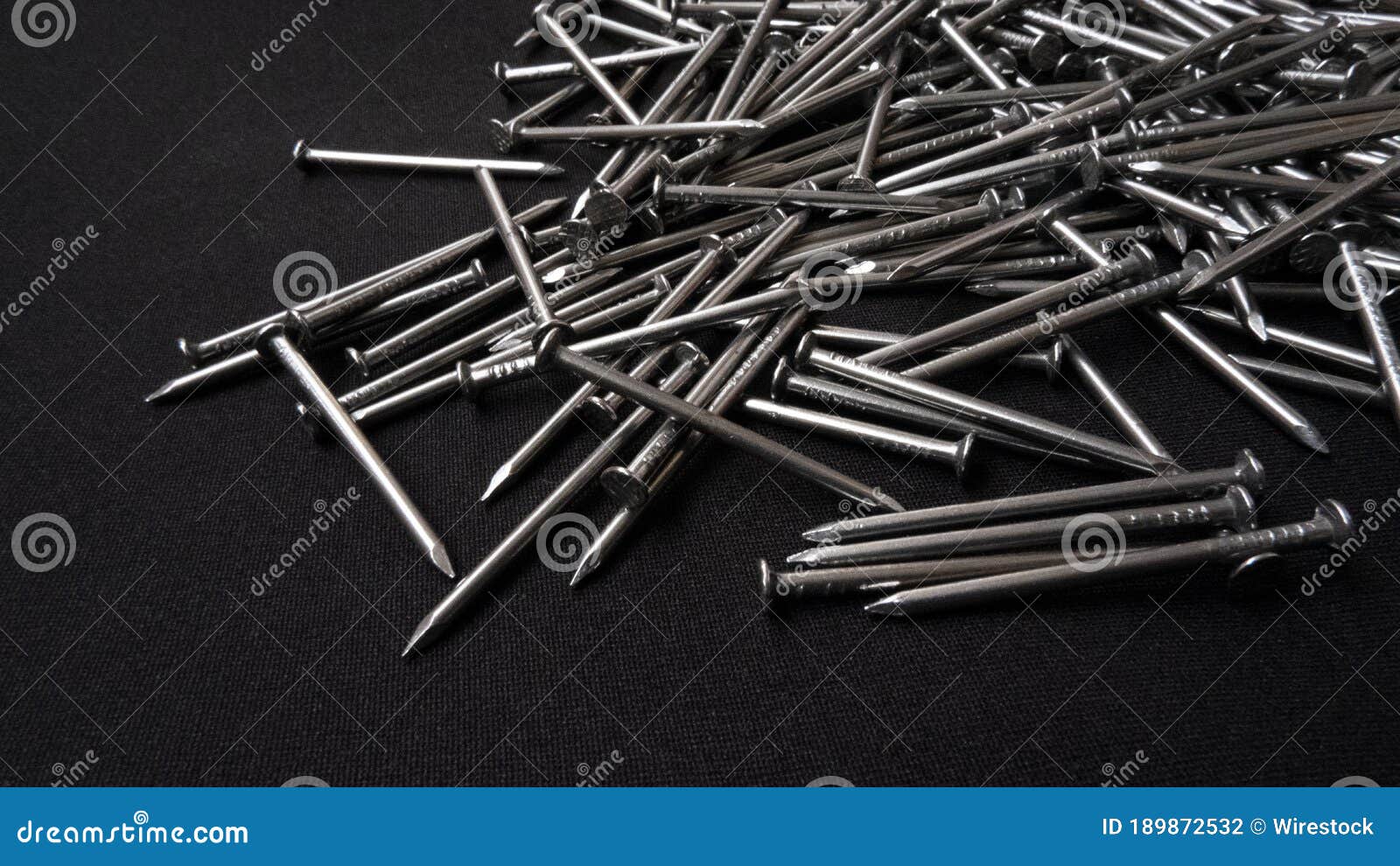 Panoramic Shot of a Pile of Steel Nails on a Black Background Stock ...