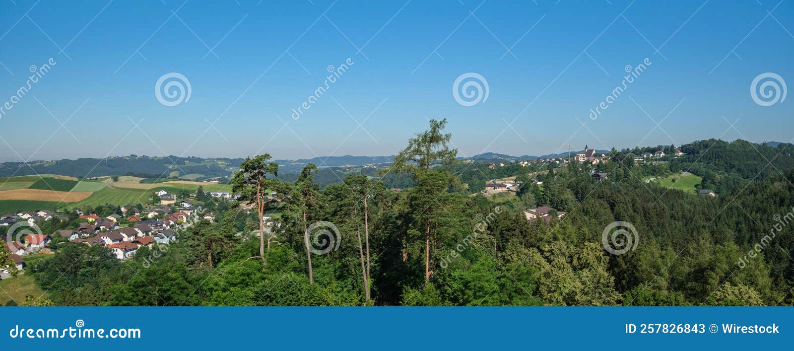 panoramic shot of the view along the trail of schlosserweg in grein, austria