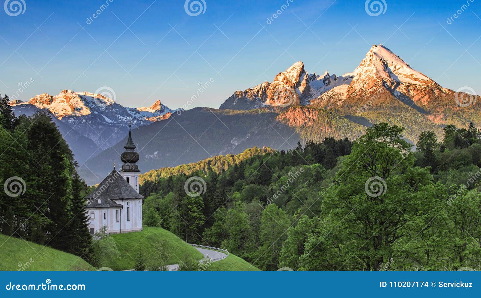panoramic view of maria gern church with snow-capped summit of watzmann mountain