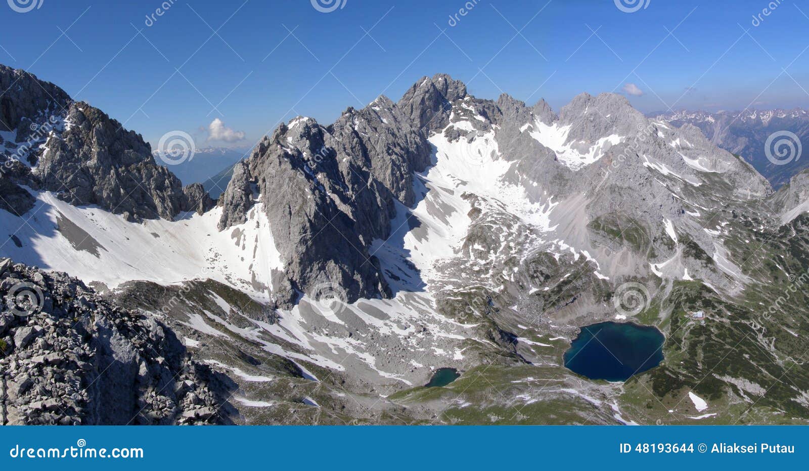 Panoramic View of an Alpine Ridge with Mountain Lake Stock Photo