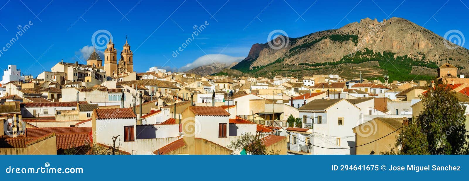 panoramic view of an andalusian village with its white houses and tall church towers, velez rubio, andalusia.