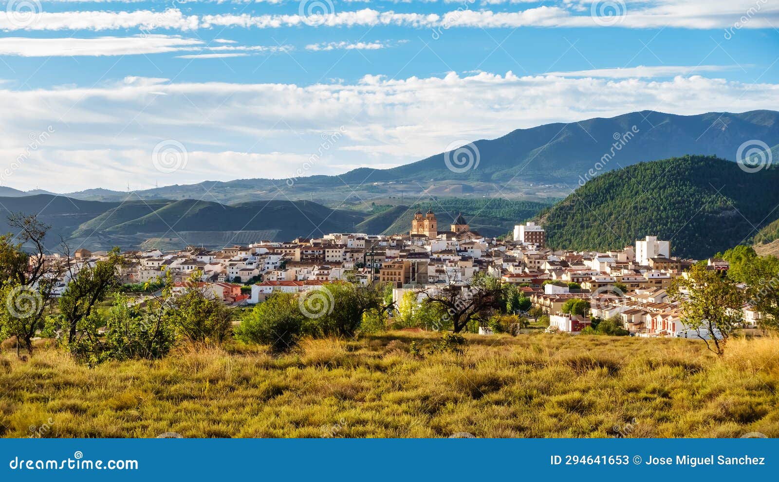 panoramic view of the andalusian white village next to the high mountains that surround it, velez rubio, almeria.