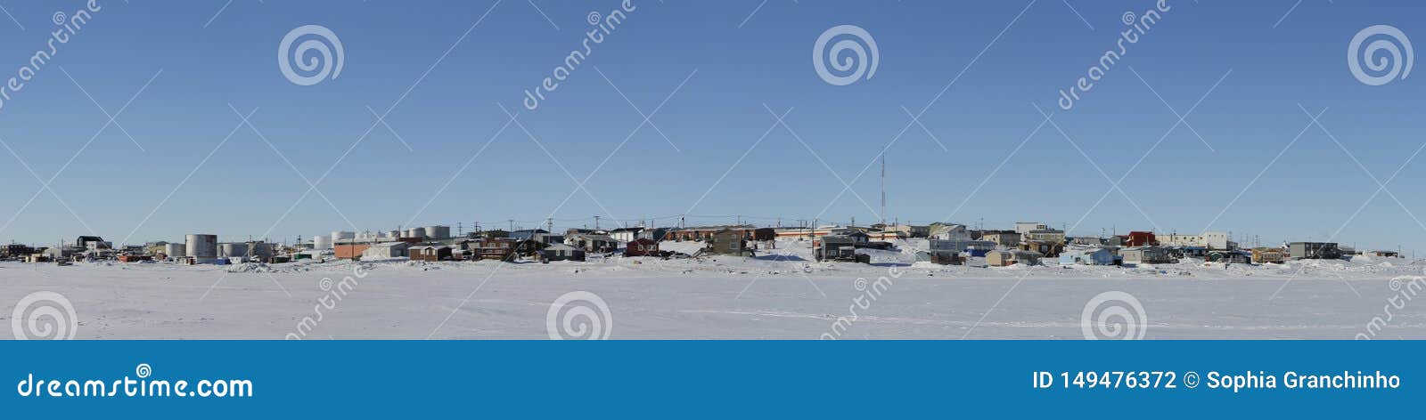 panoramic view of cambridge bay, nunavut, a far northern arctic community, during a sunny winter day