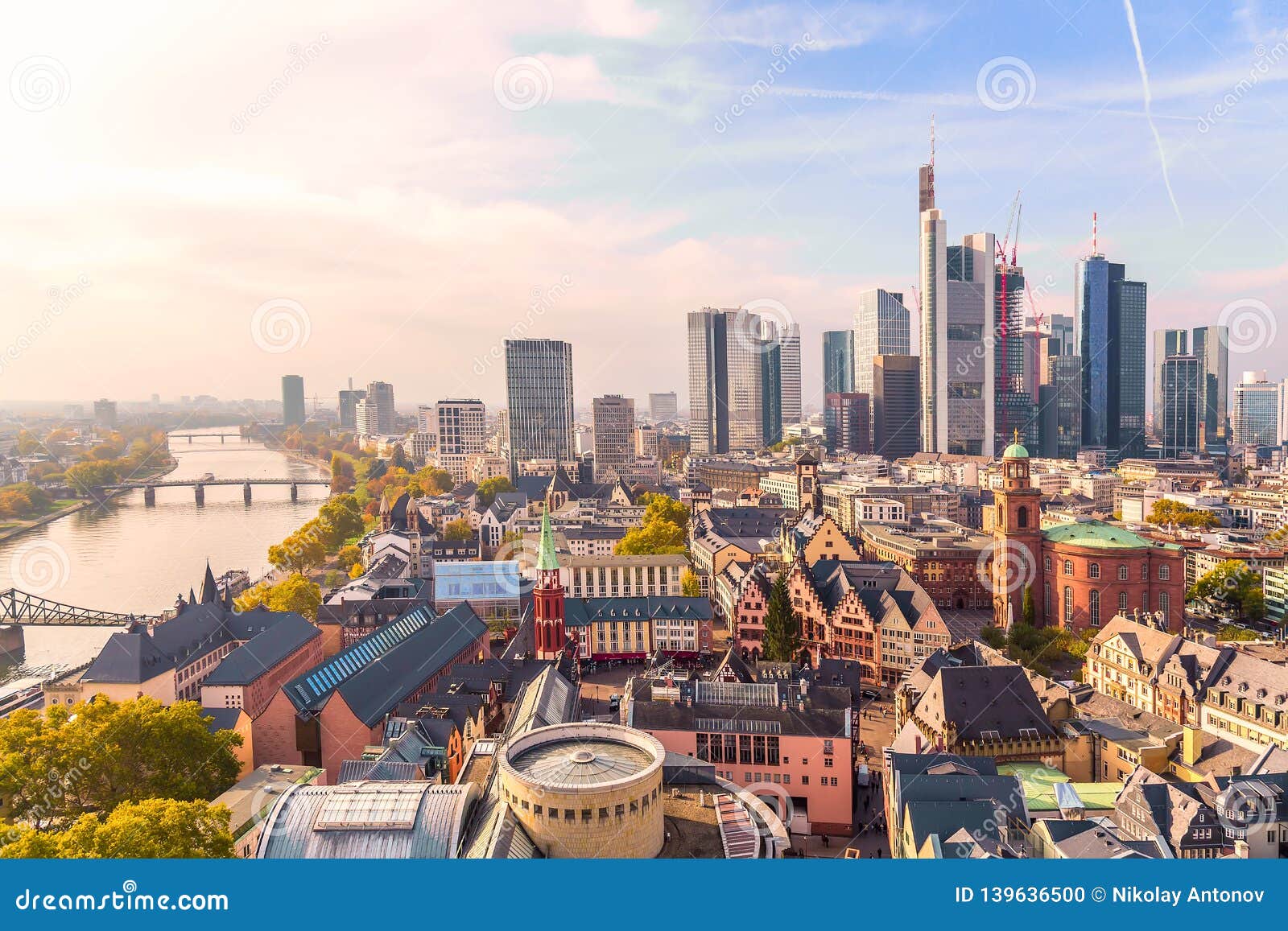 panoramic view cityscape skyline of business district with skyscrapers during sunrise, frankfurt am main. hessen, germany