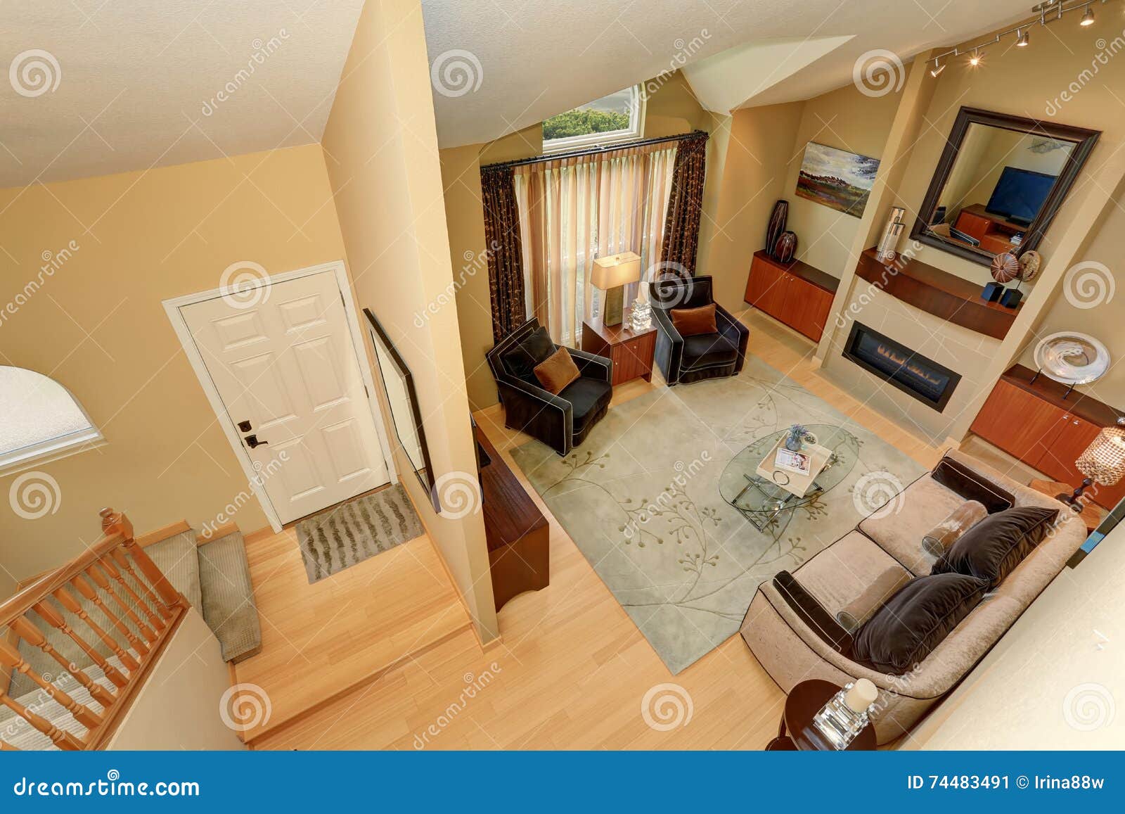 Panoramic View Of Elegant Living Room And Entryway From Upstairs
