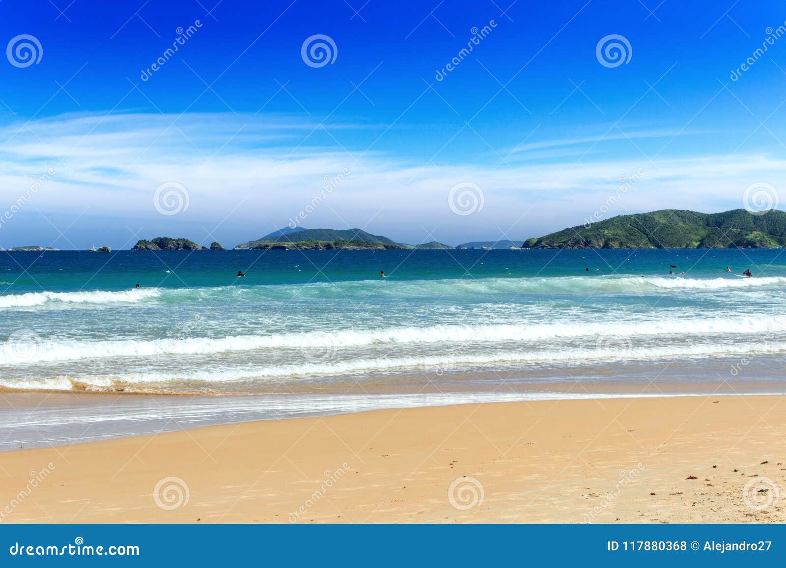 geriba beach, buzios, rio de janeiro, brazil: panoramic view of the geriba beach in a sunny day. blue sea with waves and golden sa
