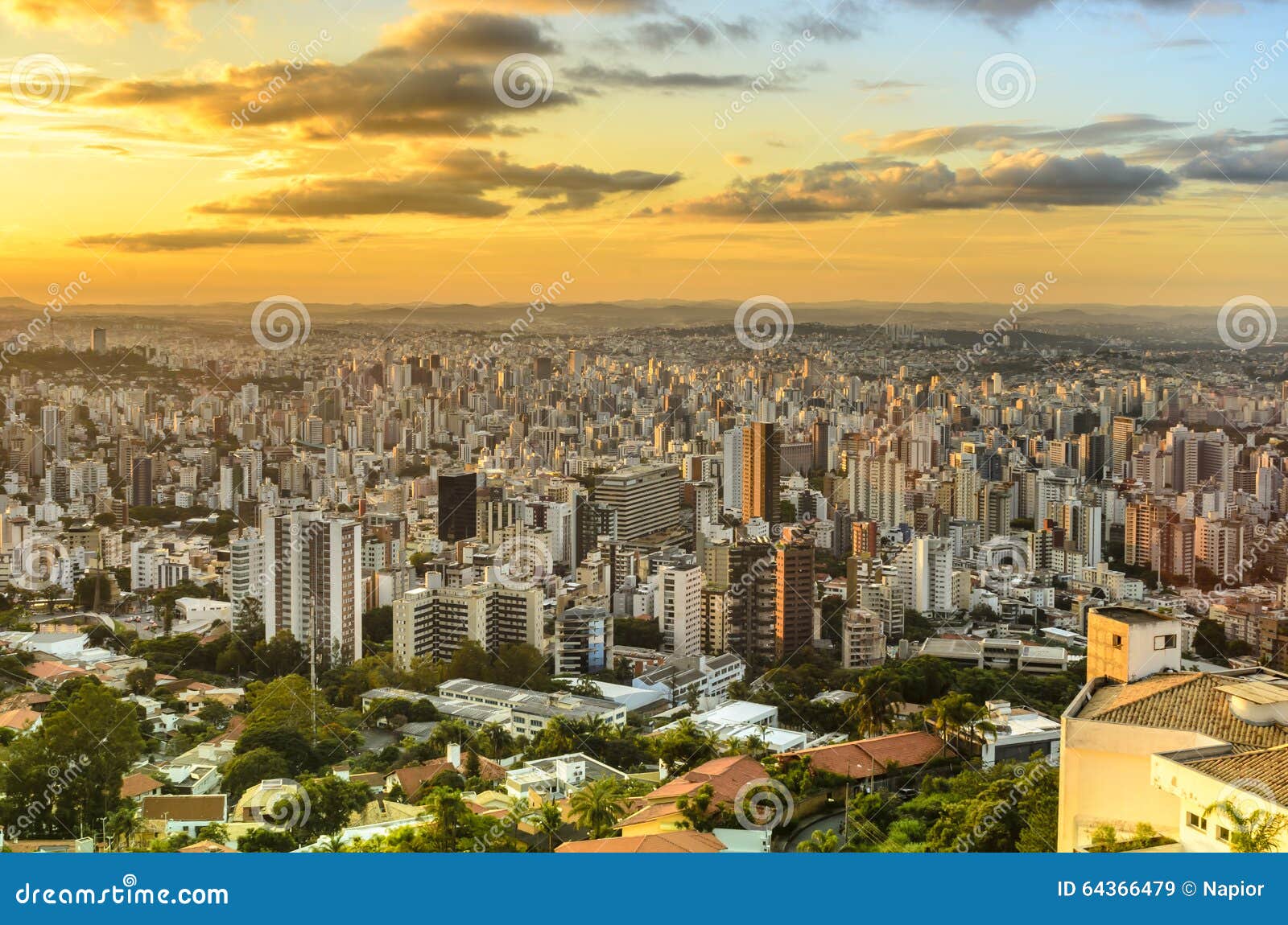 panoramic view of golden sunset in city belo horizonte , brazil .