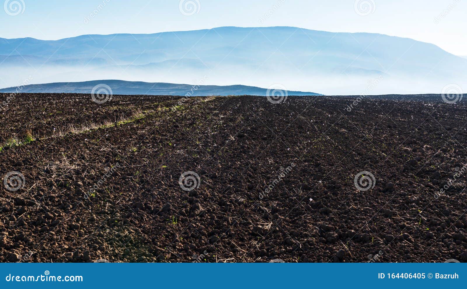 Panoramic View of a Plowed Farm Field in the Foothills Stock Image