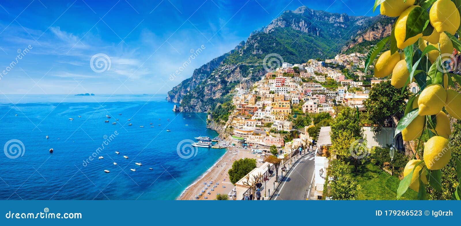 panoramic view of positano with comfortable beaches and blue sea on amalfi coast in campania, italy. amalfi coast is popular