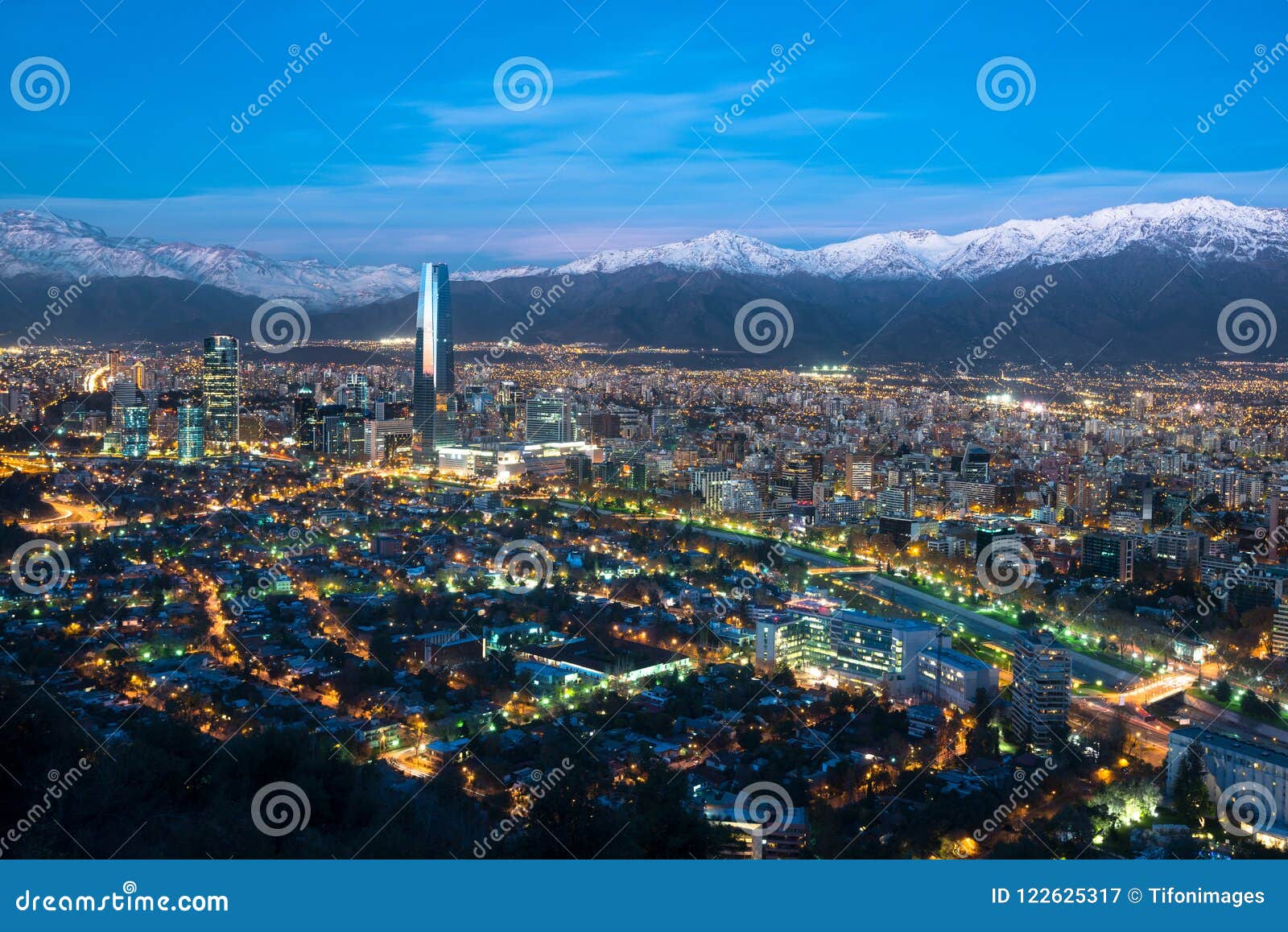 panoramic view of providencia and las condes districts with mapocho river and los andes mountain range in santiago